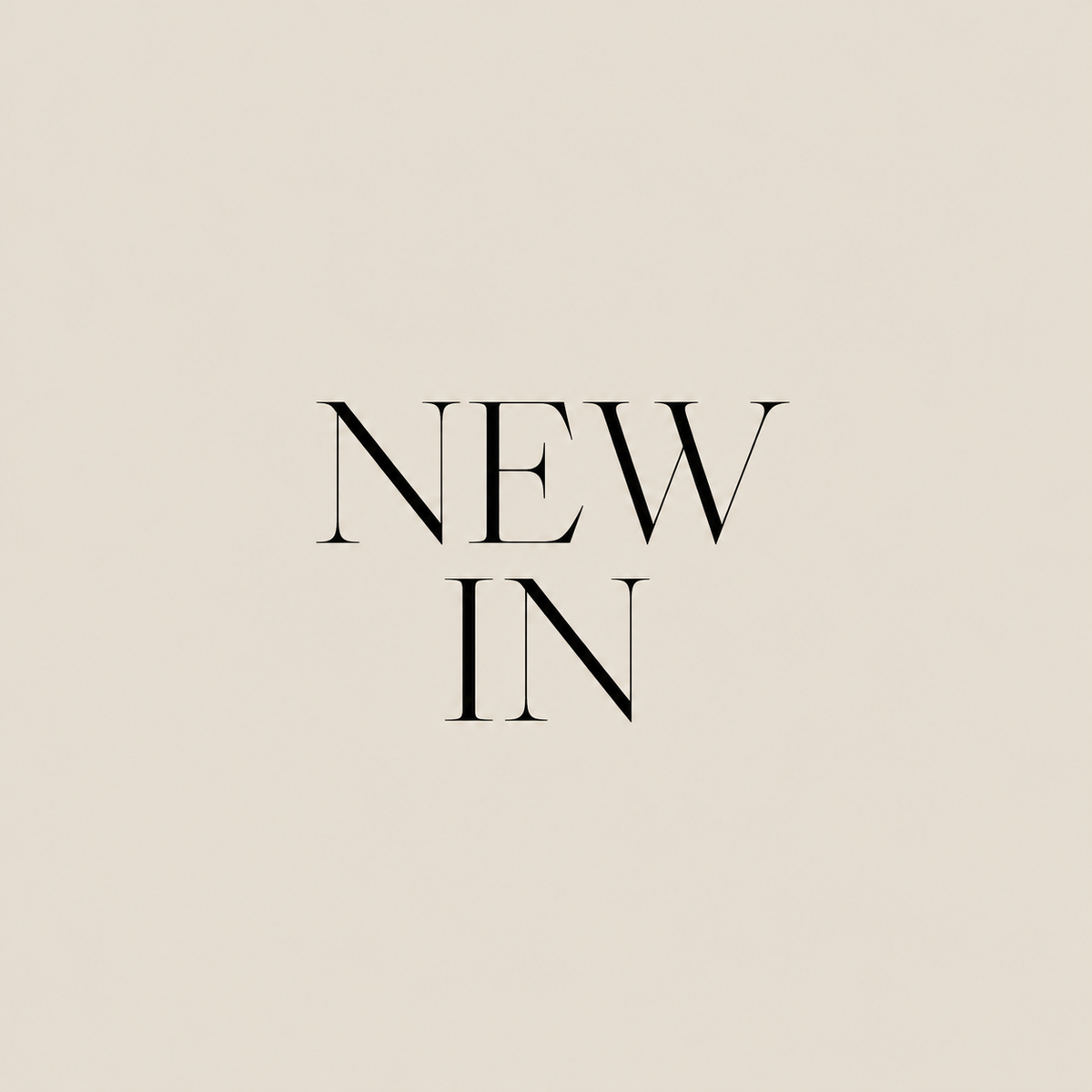 NEW IN in elegant black serif lettering on beige