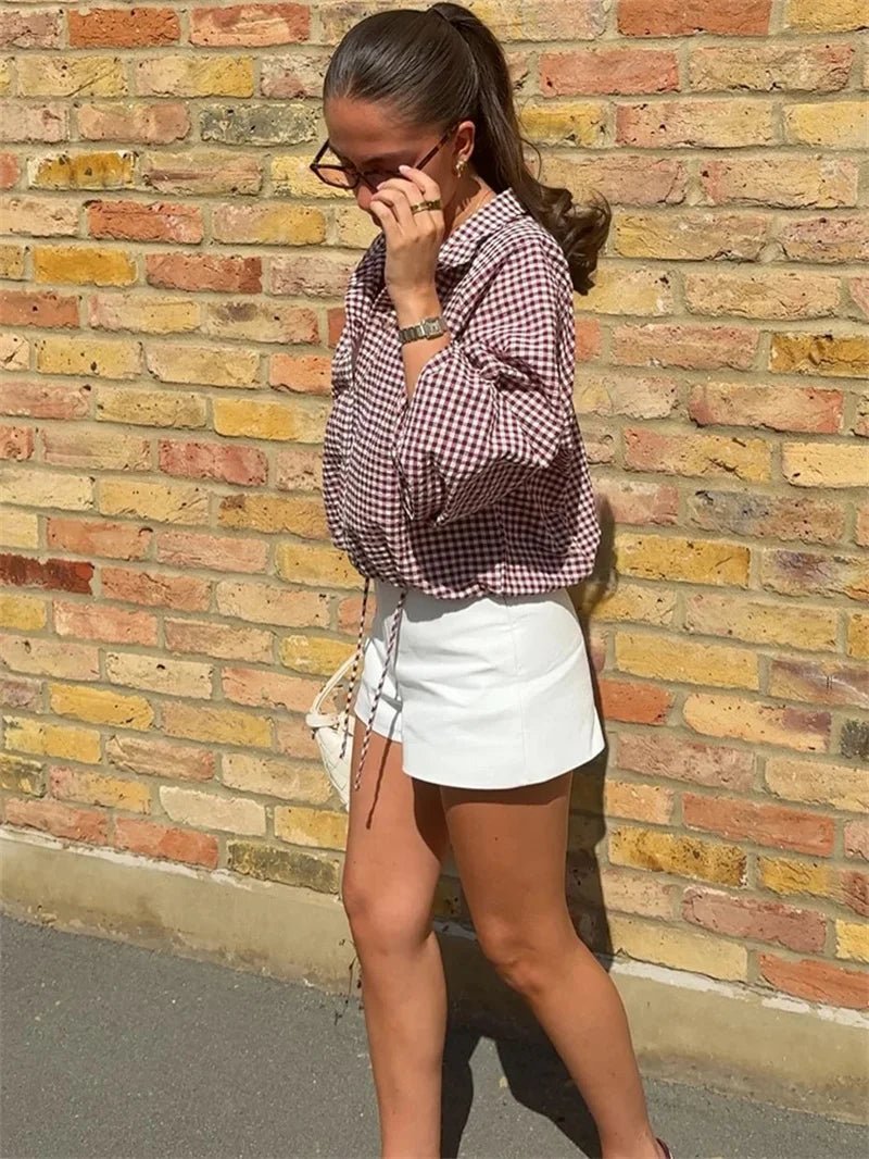 Chaqueta Mila de cuadros con cuello alto y cordón ajustable